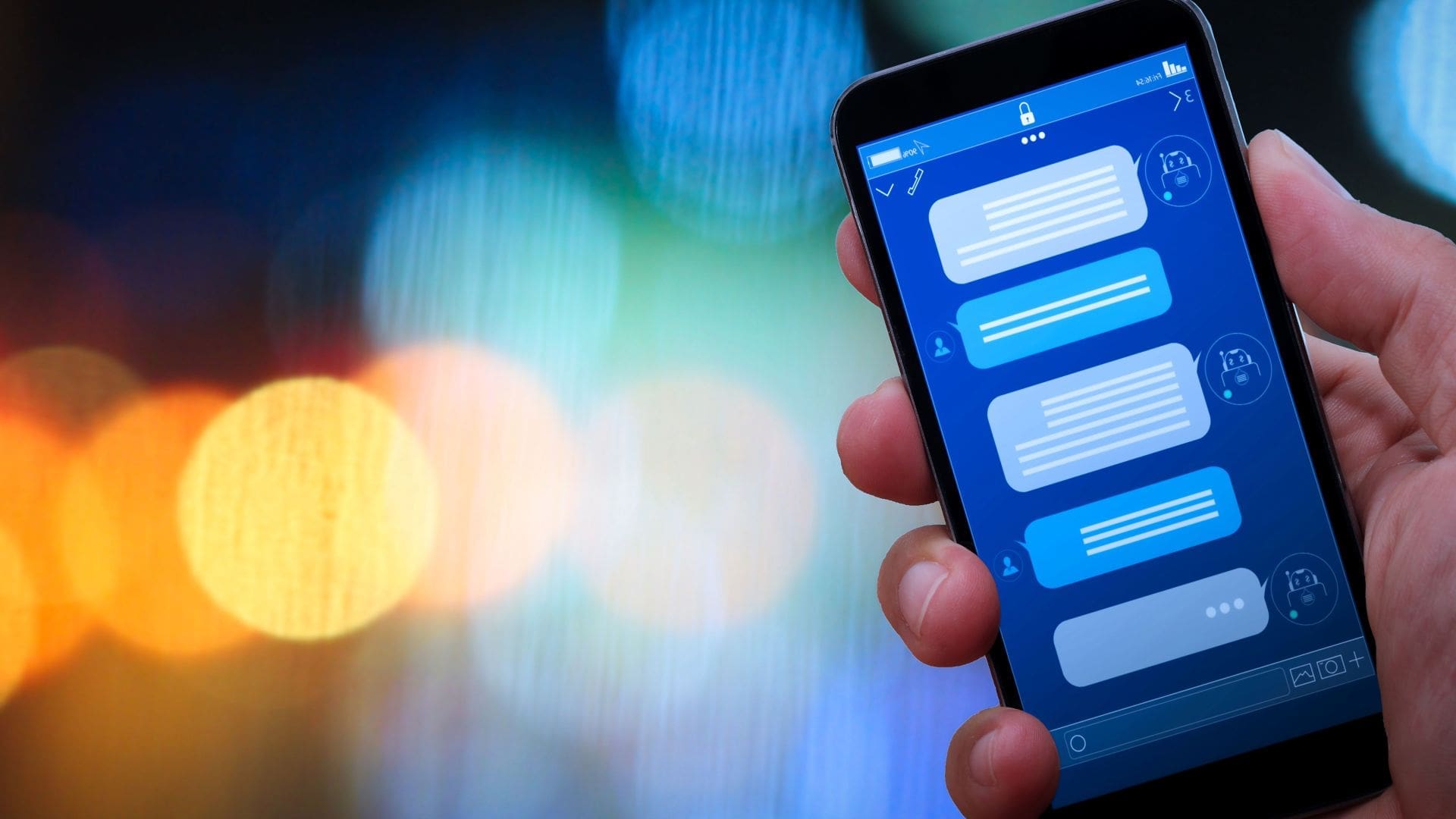 Technology industry-3 key takeaways for a competitive CX. Hand holding a smartphone that shows a chat with a chatbot