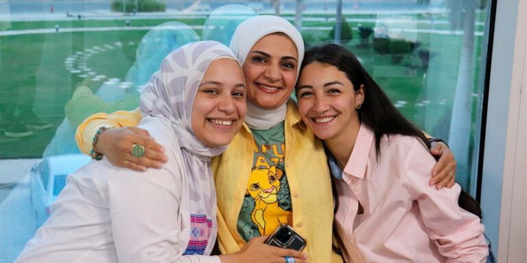 Three women smiling together