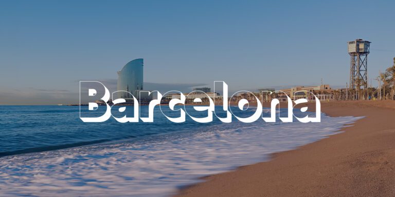 A view of the coast of Barcelona, Spain with the word "Barcelona" displayed