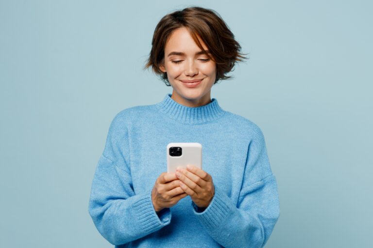Woman looking a a smartphone and interacting with social media care