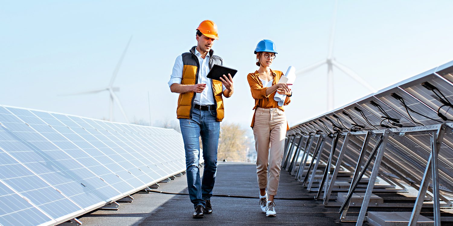 Two utilities employees walking together