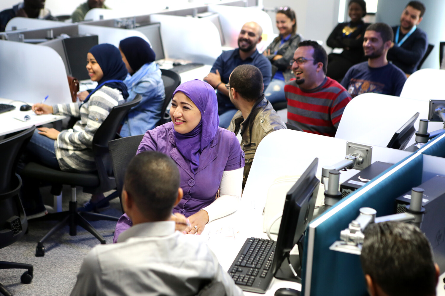 View of Foundever customer care team members in Fez, Morocco, listening to announcements