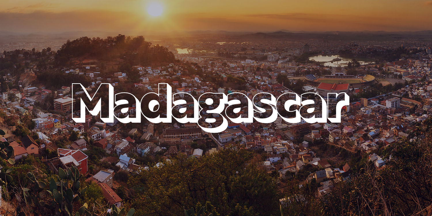 The word "Madagascar" is placed over a background showing the city