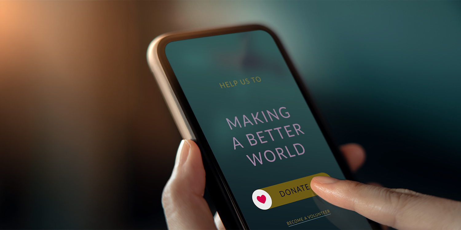Closeup of a smartphone and donating to a charity