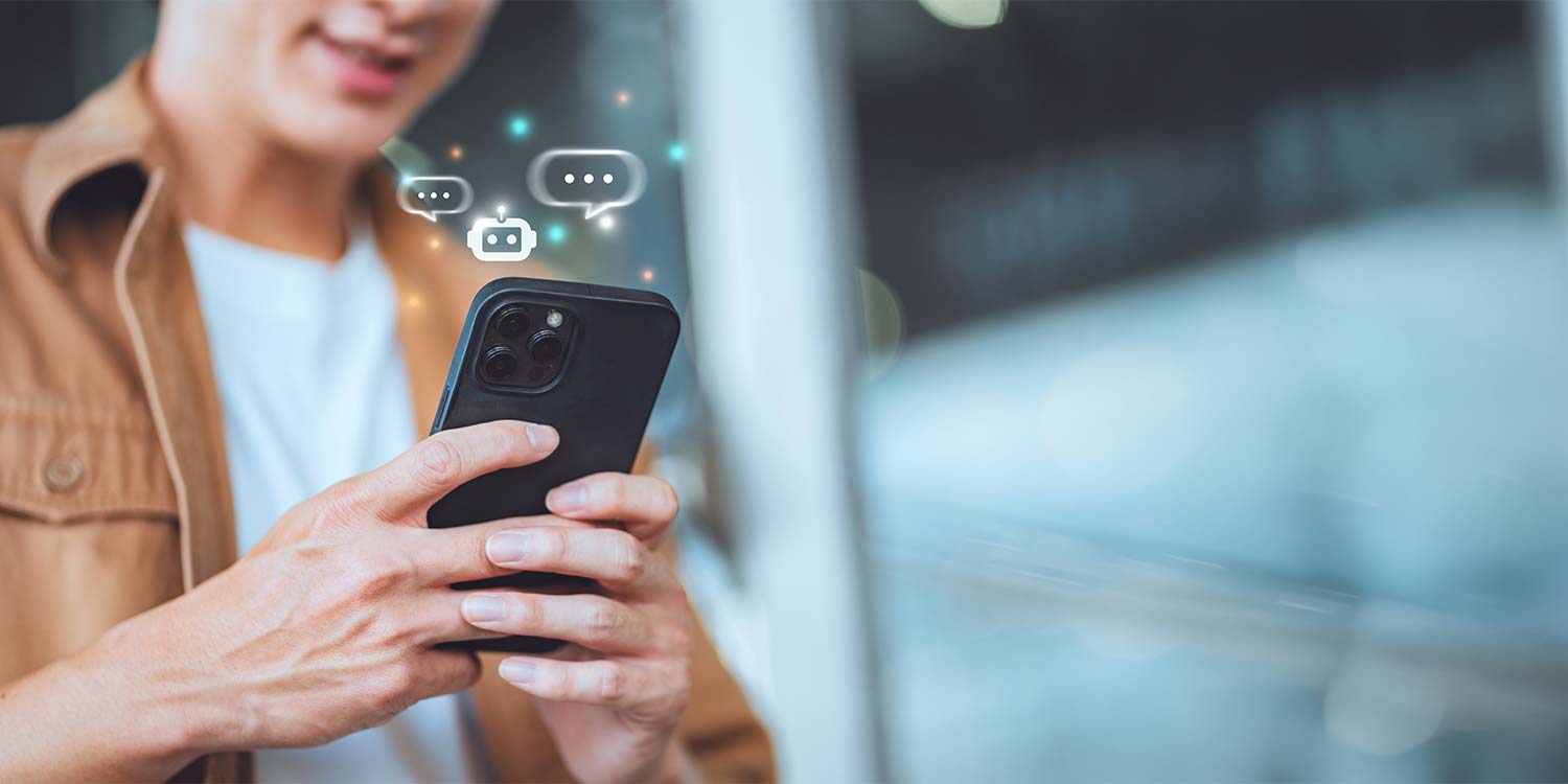 A man looks at his smartphone and gets help from agentic AI