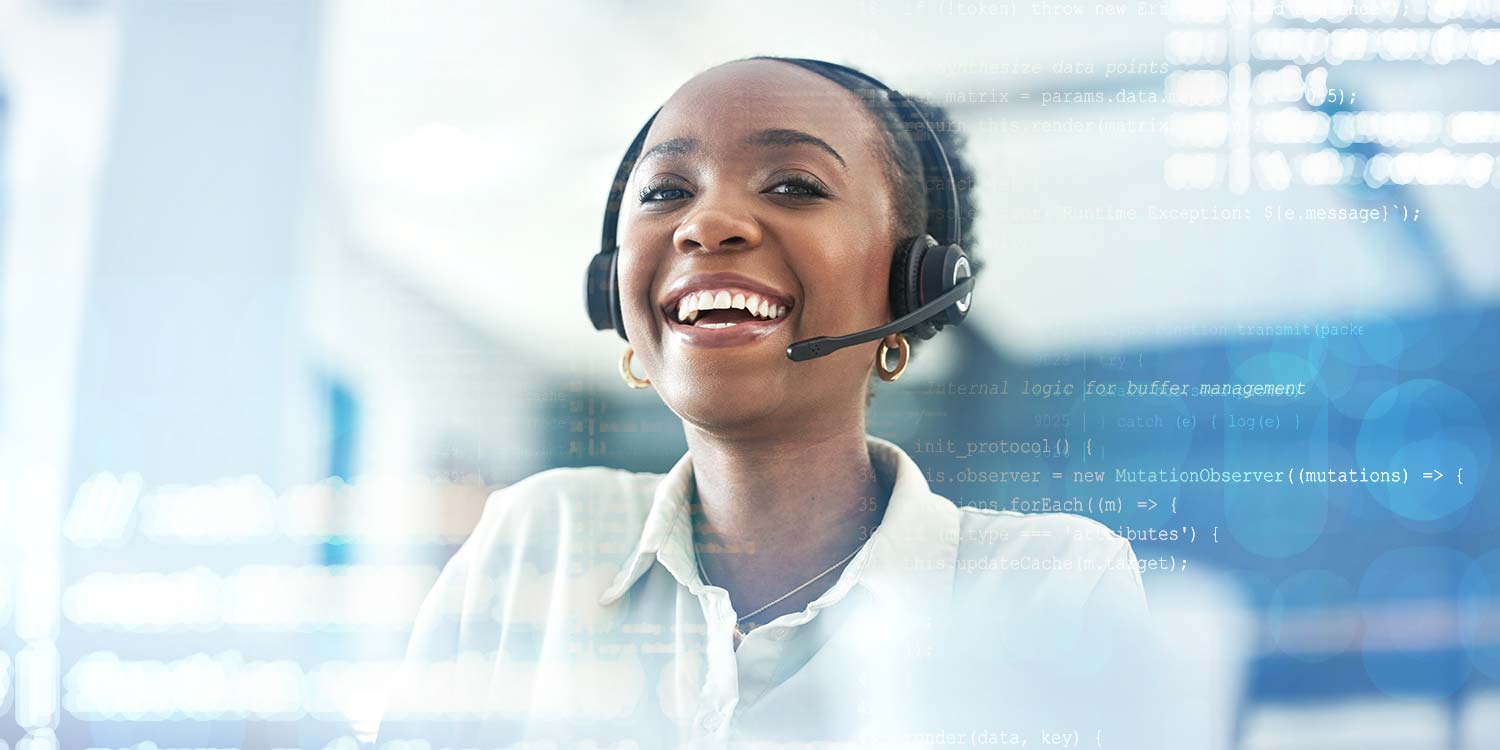 A female customer experience agent wearing a headset smiles